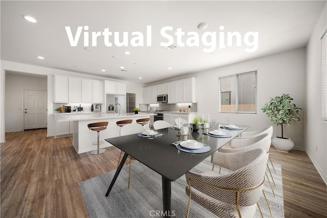 29391 Santa Ynez Cir, Menifee, CA 92584 - dining area with baseboards, recessed lighting, and wood finished floors