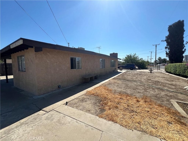 view of property exterior with stucco siding