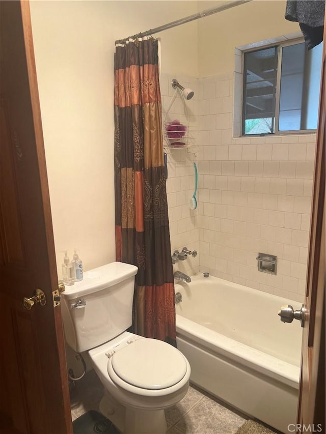 bathroom featuring tile patterned floors, shower / tub combo with curtain, and toilet