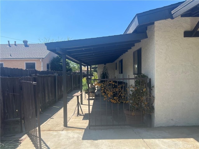 view of patio with fence