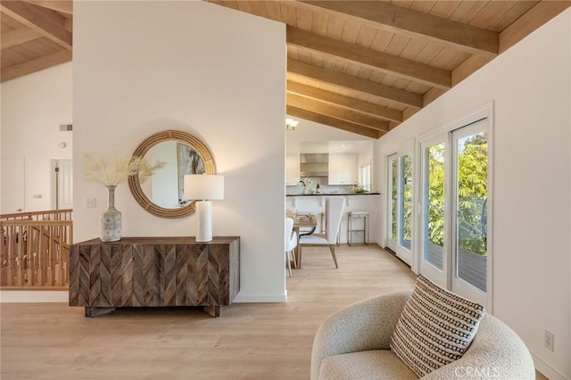 sitting room featuring beamed ceiling, light wood-style floors, visible vents, and wood ceiling