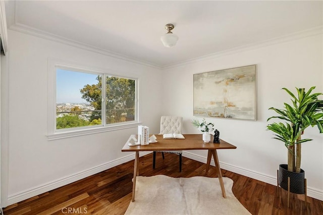 office space with baseboards, crown molding, and wood finished floors