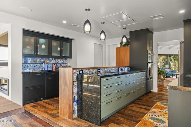 1417 Foothill Rd, Ojai, CA 93023 - indoor bar with dark wood-style floors, decorative light fixtures, and recessed lighting