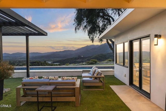 1417 Foothill Rd, Ojai, CA 93023 - yard at dusk with a mountain view, a swimming pool, and a yard
