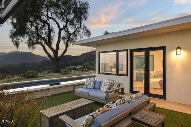 1417 Foothill Rd, Ojai, CA 93023 - deck at dusk with a mountain view and outdoor lounge area