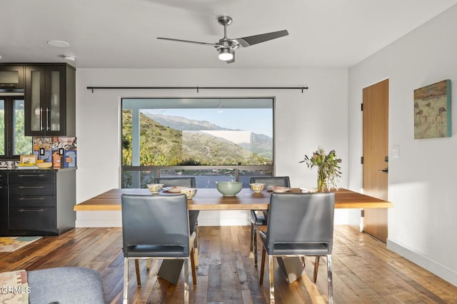 1417 Foothill Rd, Ojai, CA 93023 - dining area with wood-type flooring, ceiling fan, and baseboards