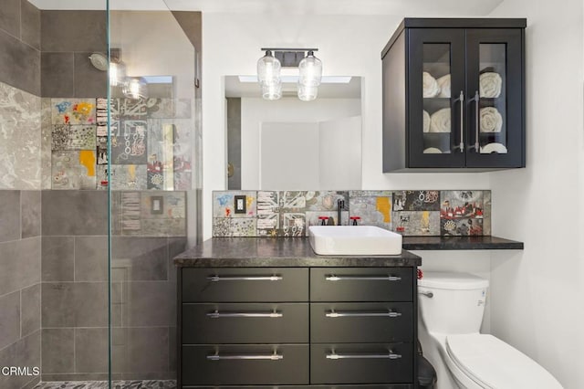 1417 Foothill Rd, Ojai, CA 93023 - full bathroom featuring vanity, toilet, tiled shower, and tasteful backsplash