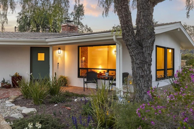 1417 Foothill Rd, Ojai, CA 93023 - entrance to property with stucco siding, a chimney, and a patio area