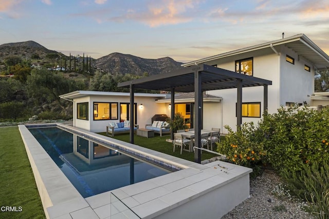 1417 Foothill Rd, Ojai, CA 93023 - back of house featuring outdoor lounge area, stucco siding, a mountain view, and an outdoor pool