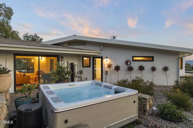 1417 Foothill Rd, Ojai, CA 93023 - rear view of house with a hot tub and stucco siding