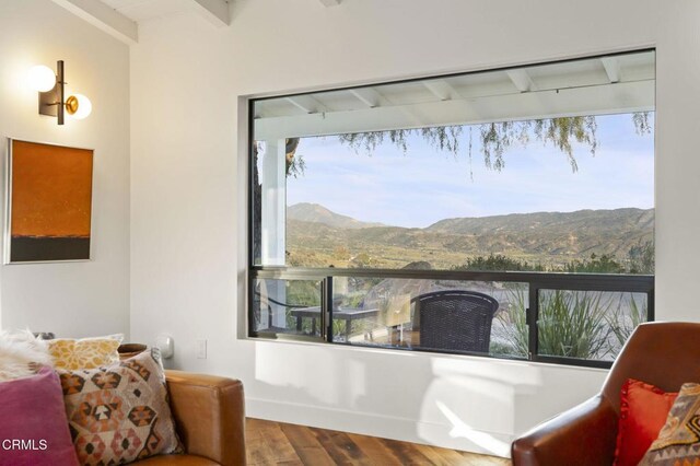 1417 Foothill Rd, Ojai, CA 93023 - living area featuring beam ceiling, wood finished floors, and a mountain view