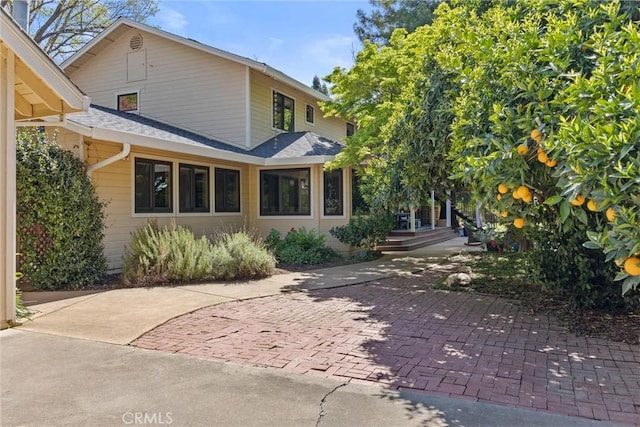 15 Quadra Ct, Chico, CA 95928 - rear view of house featuring roof with shingles