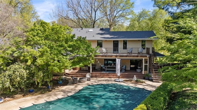 15 Quadra Ct, Chico, CA 95928 - rear view of property featuring a deck, stairs, a covered pool, and a patio area