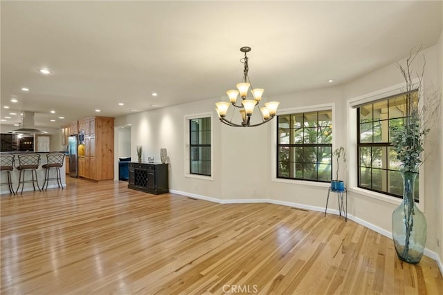 15 Quadra Ct, Chico, CA 95928 - unfurnished living room featuring a chandelier, light wood-type flooring, recessed lighting, and baseboards