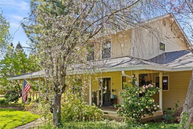 15 Quadra Ct, Chico, CA 95928 - back of property featuring covered porch and a shingled roof
