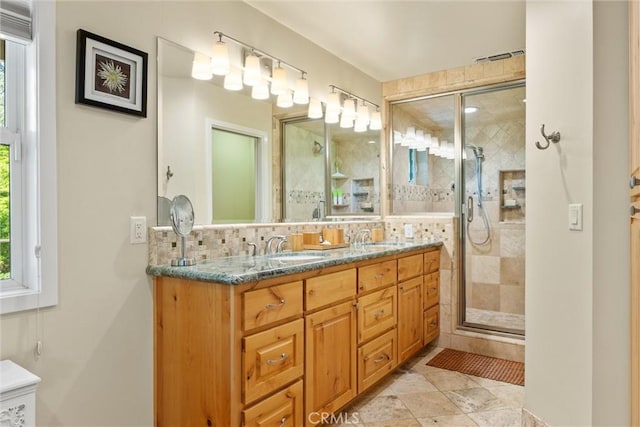 15 Quadra Ct, Chico, CA 95928 - bathroom featuring double vanity, a stall shower, and decorative backsplash
