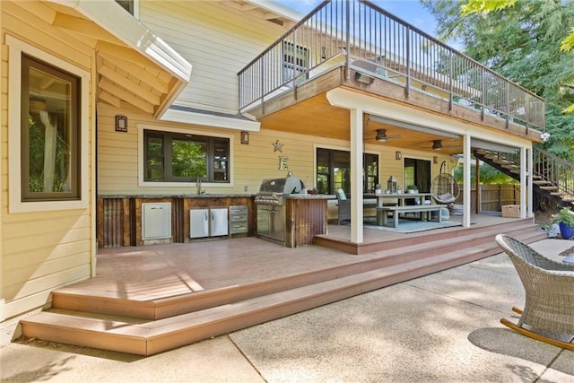 15 Quadra Ct, Chico, CA 95928 - rear view of house with a balcony, exterior kitchen, a sink, a deck, and stairway