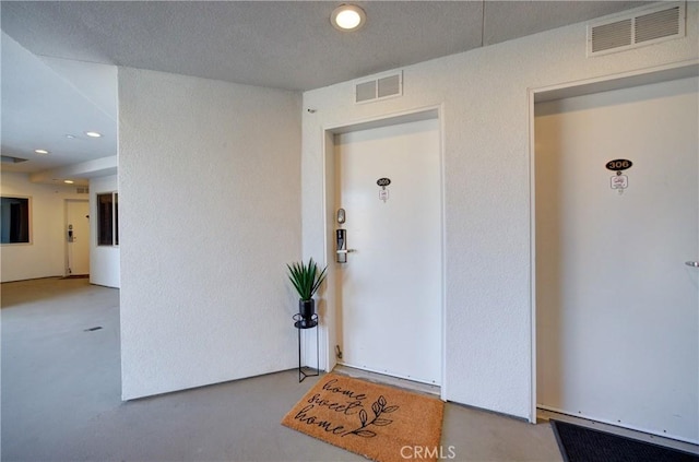 entrance to property featuring visible vents