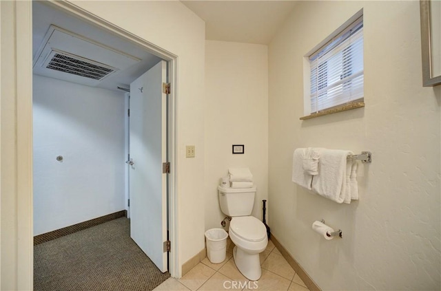bathroom featuring visible vents, toilet, and baseboards