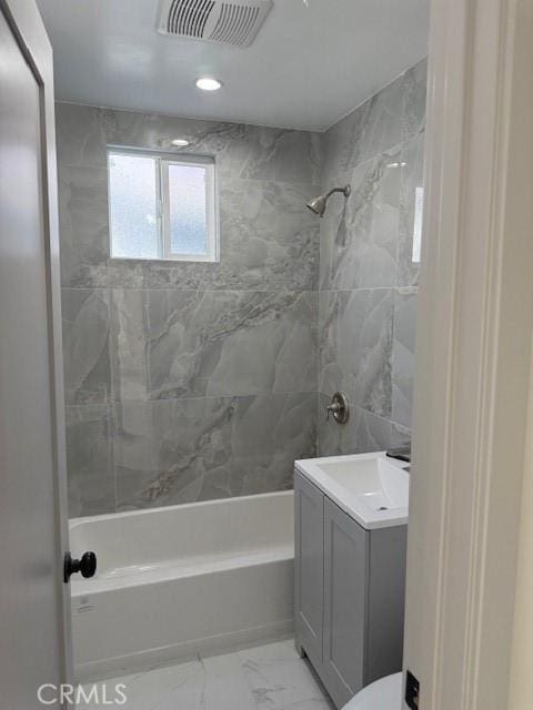 full bathroom with shower / bathing tub combination, visible vents, marble finish floor, and vanity
