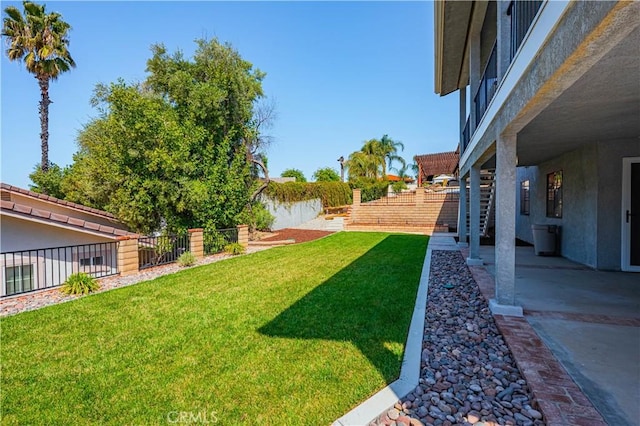 view of yard with a patio area and a fenced backyard