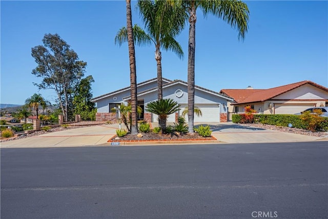 view of front of house with a garage and driveway