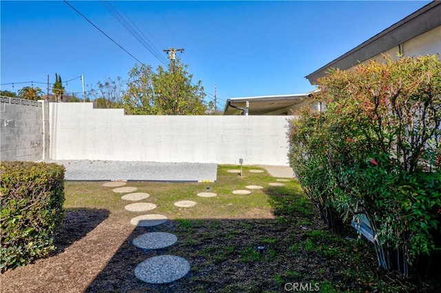 view of yard with a fenced backyard