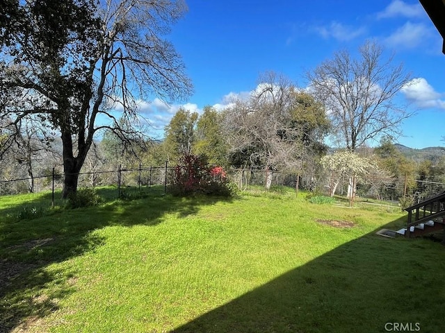 view of yard featuring fence