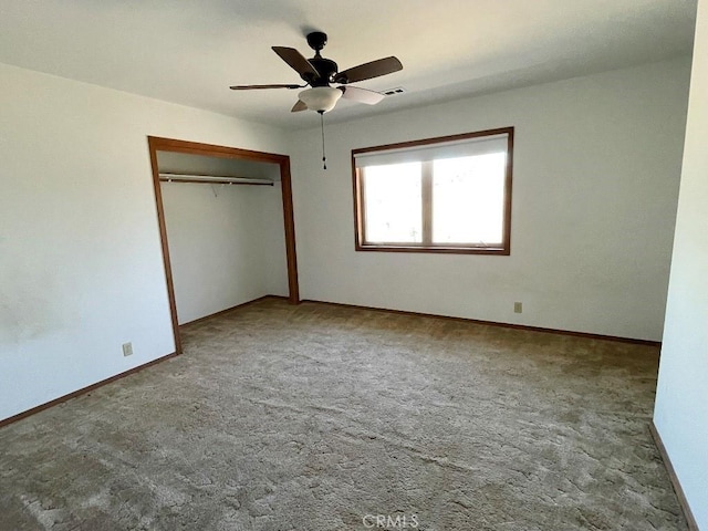 unfurnished bedroom featuring a closet, carpet flooring, baseboards, and visible vents
