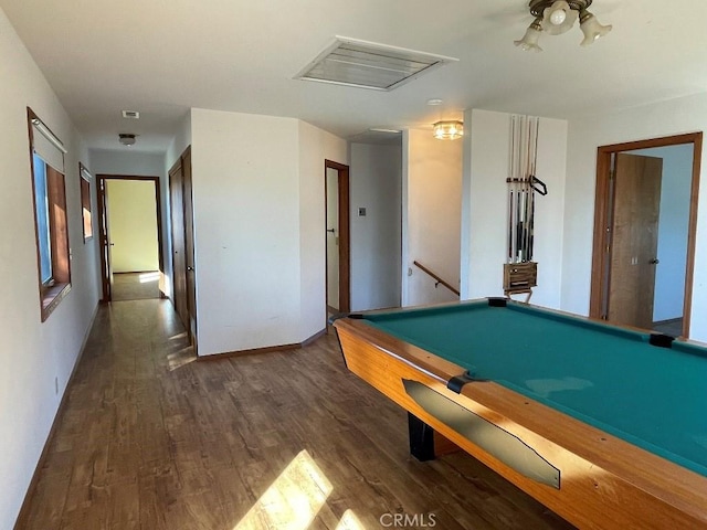 rec room featuring visible vents, baseboards, a ceiling fan, attic access, and dark wood-type flooring