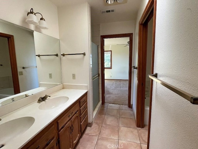 full bath with a sink, visible vents, and tile patterned flooring