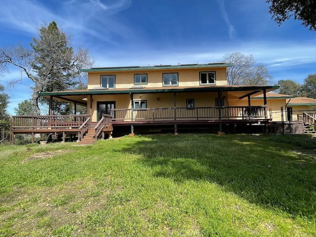 rear view of property with a yard