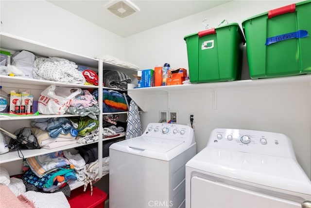 washroom with separate washer and dryer and laundry area