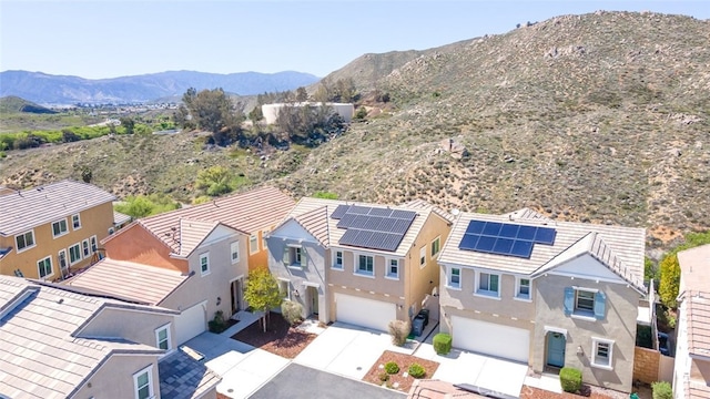 drone / aerial view featuring a mountain view and a residential view