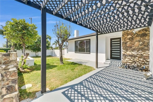 view of patio / terrace featuring fence