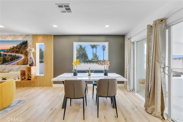 dining room featuring light wood-style flooring, visible vents, and recessed lighting