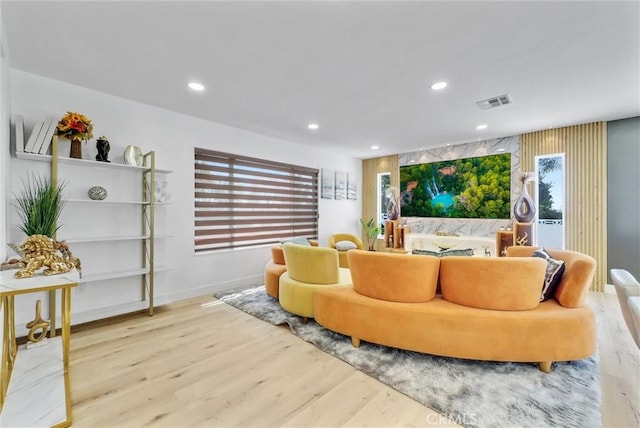 interior space with visible vents, recessed lighting, and wood finished floors