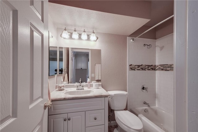 bathroom featuring shower / washtub combination, toilet, a textured wall, a textured ceiling, and vanity