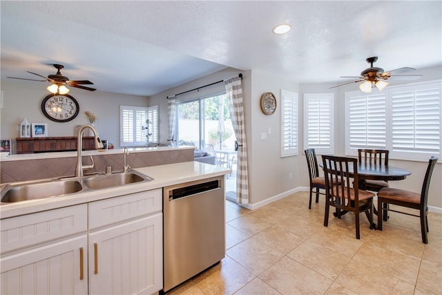 kitchen featuring light tile patterned floors, light countertops, ceiling fan, dishwasher, and a sink