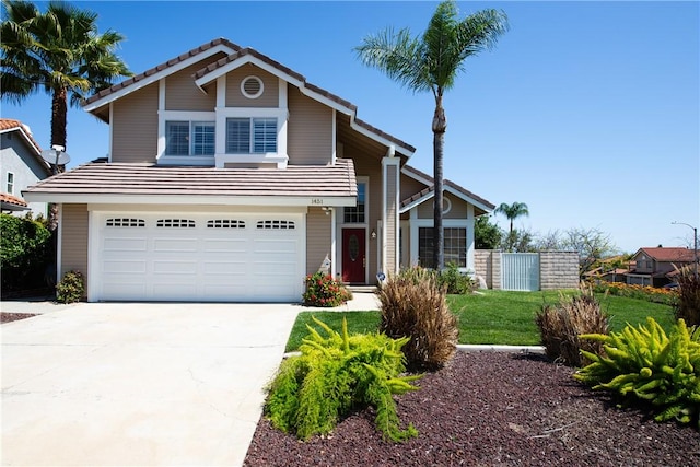 traditional-style house with concrete driveway, fence, an attached garage, and a tile roof