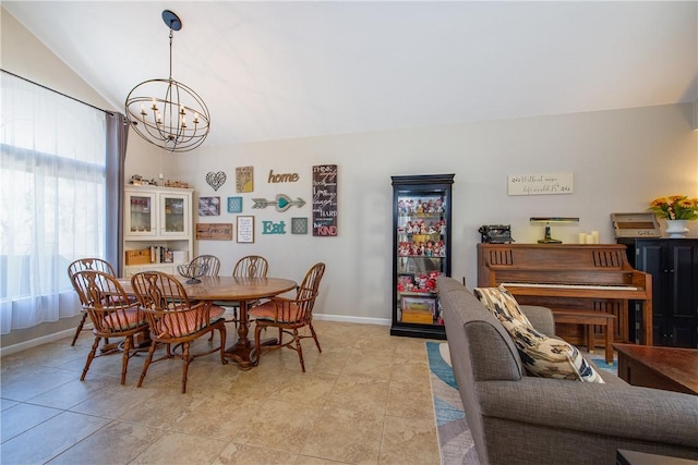 dining area with light tile patterned floors, baseboards, a notable chandelier, and vaulted ceiling