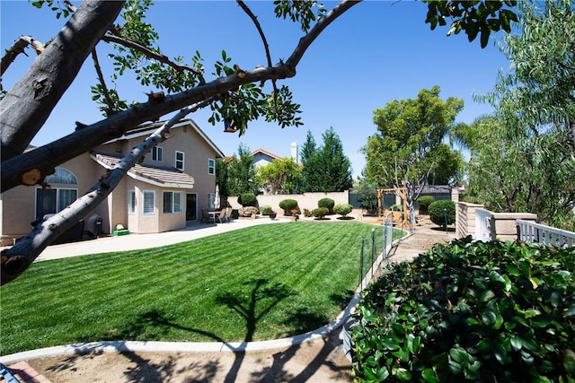 view of yard featuring a patio area and fence