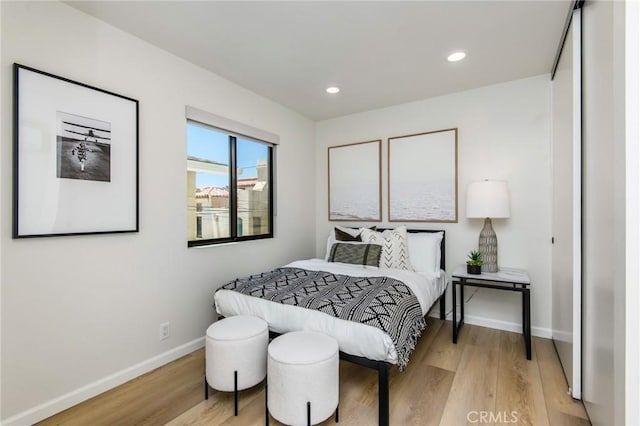 7171/2 Orchid Ave, Corona Del Mar, CA 92625 - bedroom with recessed lighting, light wood-style flooring, and baseboards