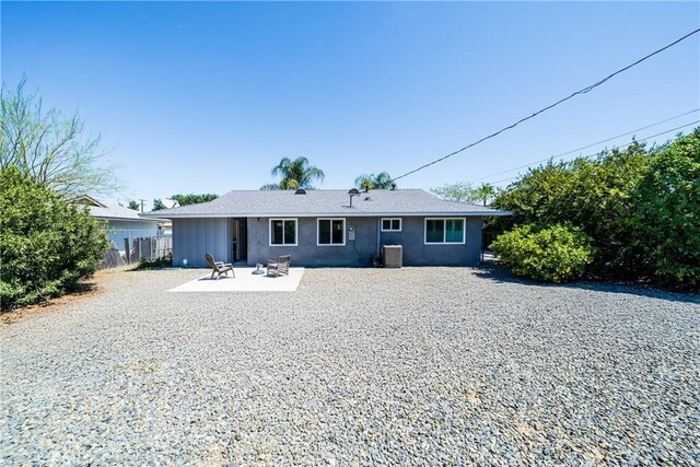 29251 Pebble Beach Dr, Menifee, CA 92586 - back of house featuring stucco siding, a patio area, central AC, and fence