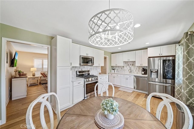 29251 Pebble Beach Dr, Menifee, CA 92586 - dining room featuring recessed lighting and light wood-style floors