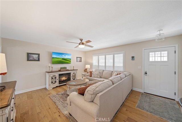 29251 Pebble Beach Dr, Menifee, CA 92586 - living area with plenty of natural light, ceiling fan, and light wood-type flooring