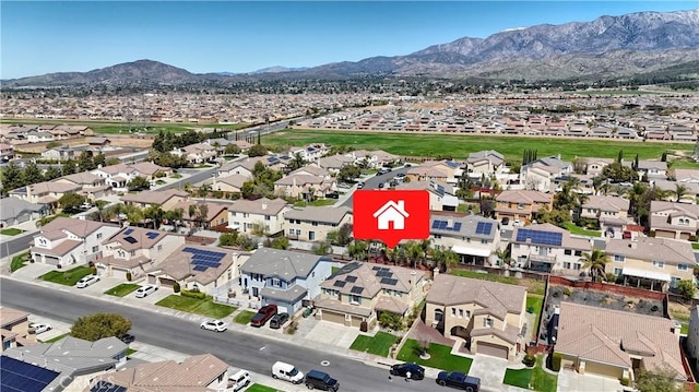 birds eye view of property featuring a mountain view and a residential view