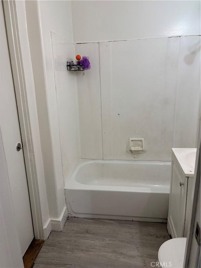 full bathroom with wood finished floors and vanity