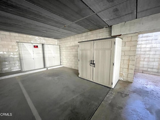 garage featuring concrete block wall