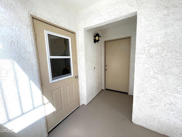 property entrance featuring stucco siding